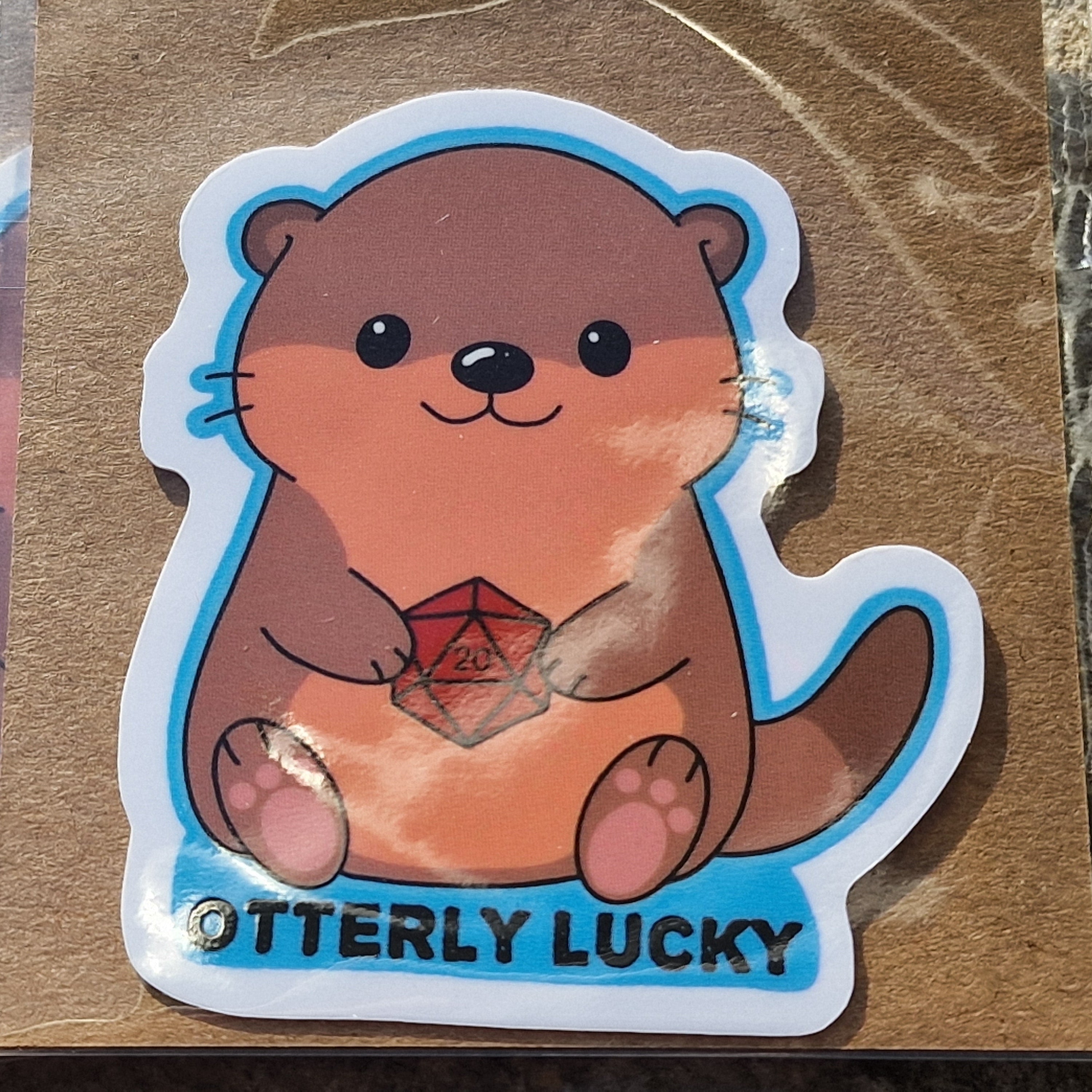 Sticker – Otterly Lucky (Otter met D20)